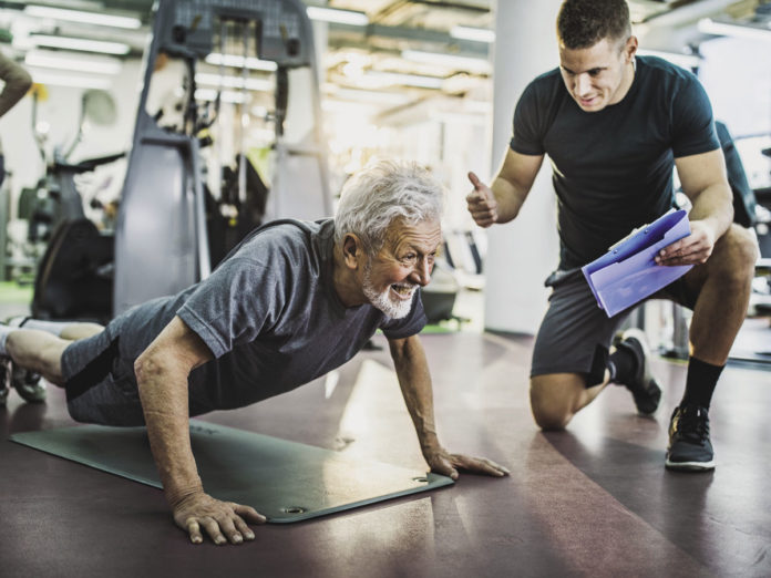 Older athlete with personal trainer