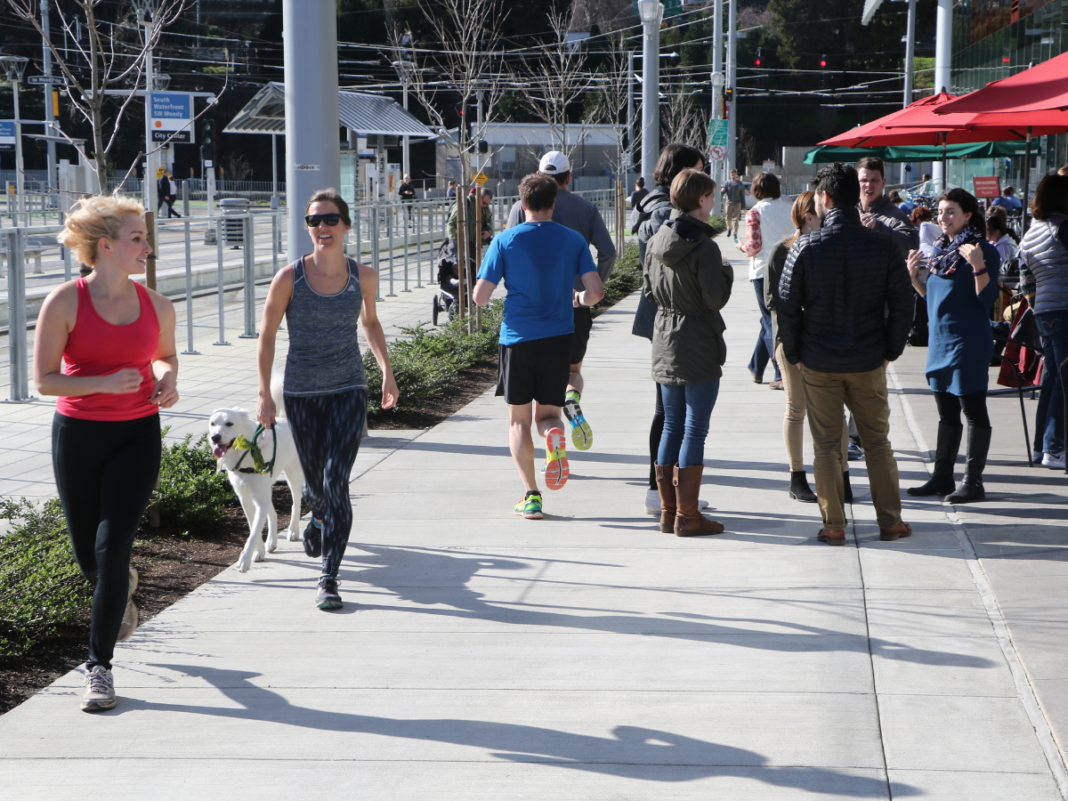 Dan Burden, Blue Zones Fellow, takes an image of pedestrians in a walkable city in the U.S.