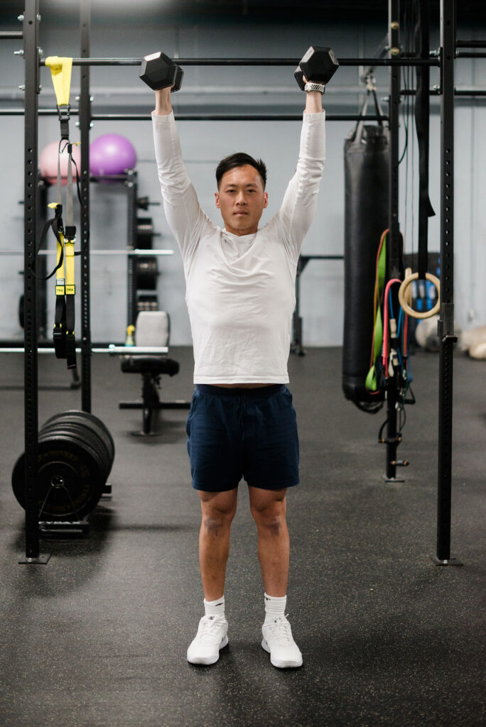 Dumbbell Swing Press
